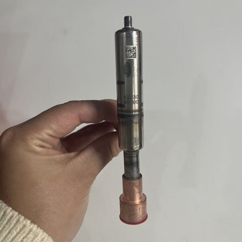 Valve body held in hand, with model marking and QR code