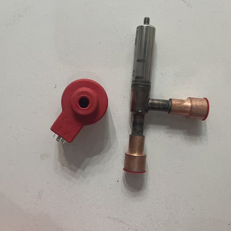Valve body and red coil accessory placed separately.