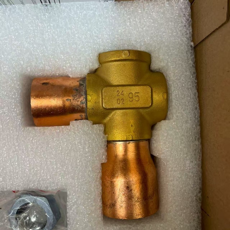 Close-up of brass valve body with “24 02 95” marking