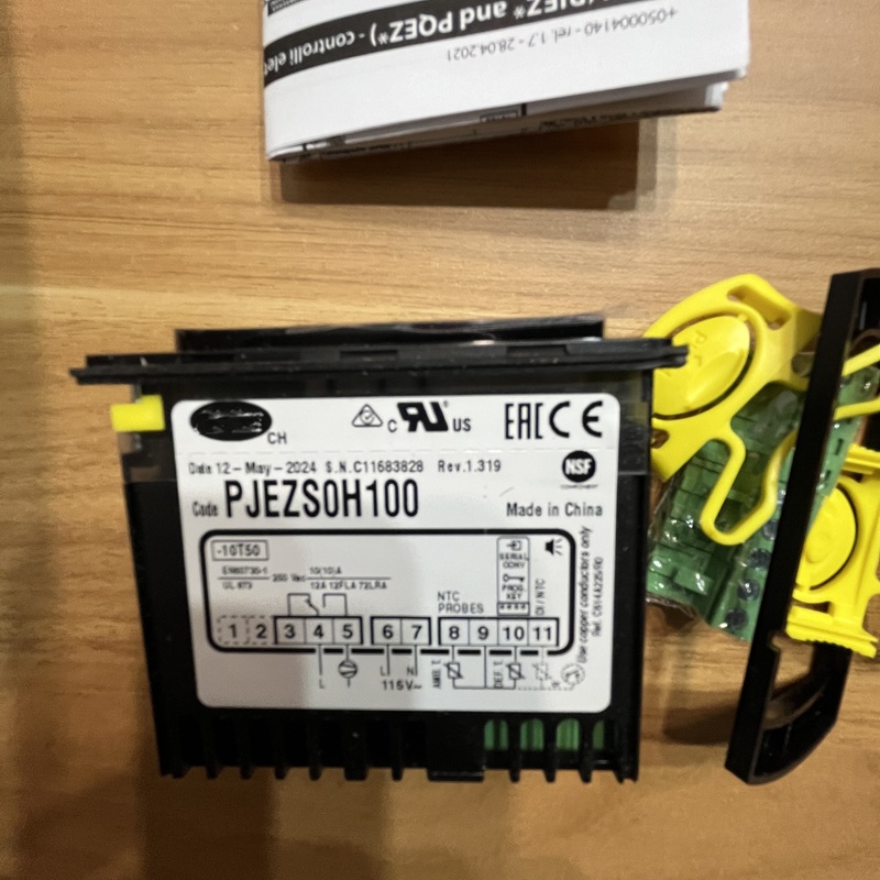 Temperature controller back with model and wiring diagram.
