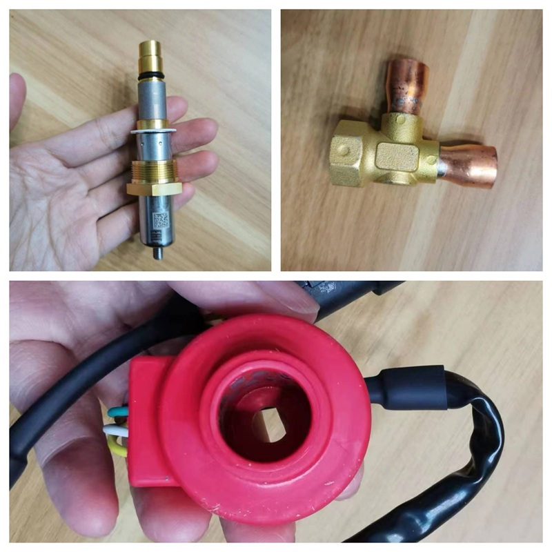 Handheld shot of electronic expansion valve spool assembly,Front view of horizontal placed three-way brass valve body,Close-up of hollow end of red drive coil