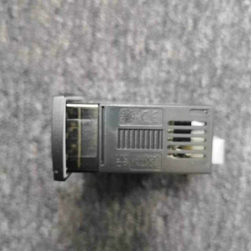 Side shell of temperature controller with heat dissipation slots and certification marks