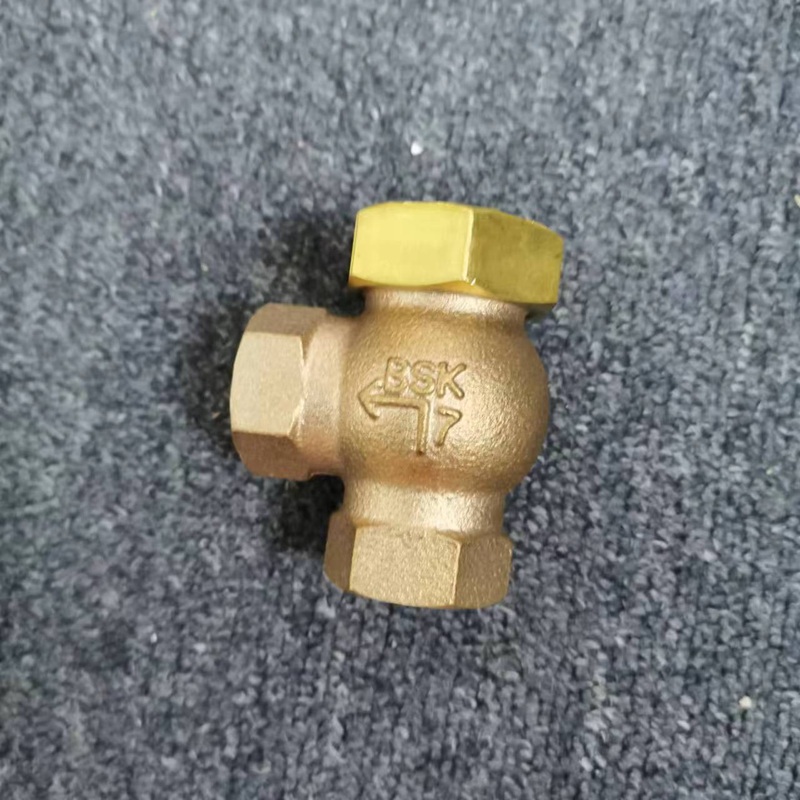 Outer view of brass angle check valve, flow arrow cast on valve body