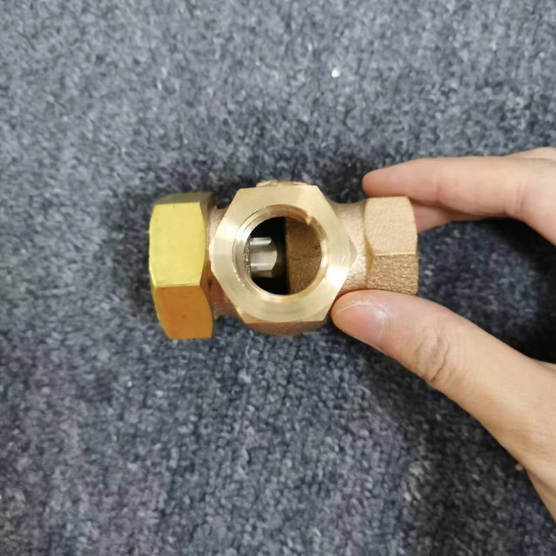 Hand-held check valve, showing inner thread port and internal spool