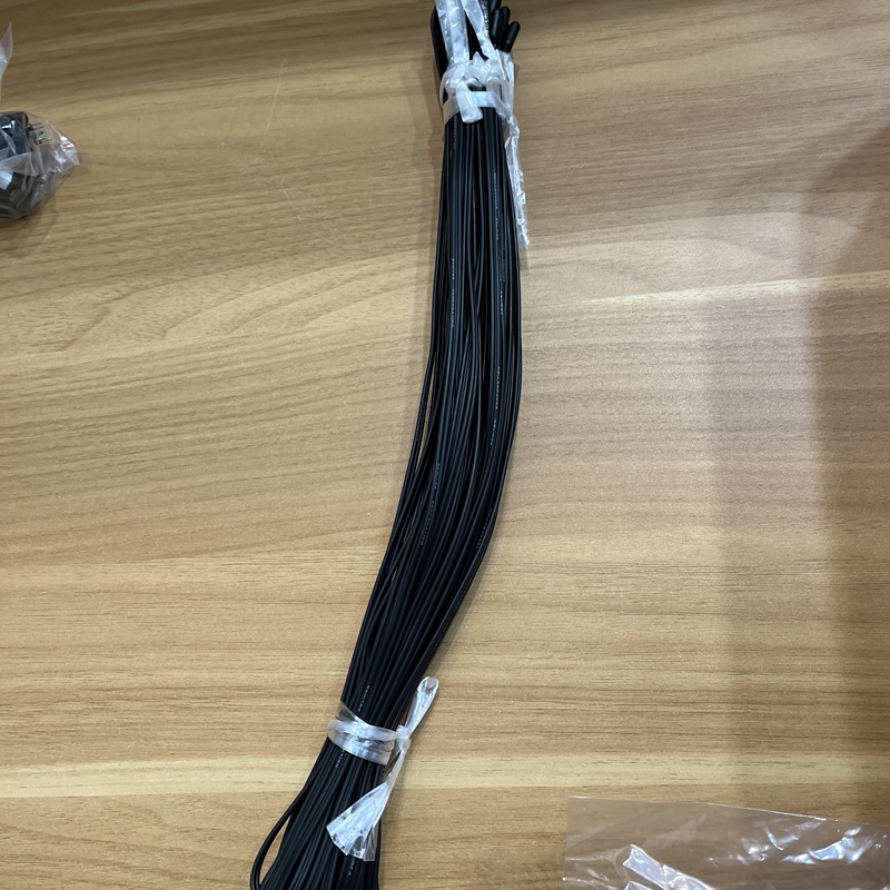 A single unopened black cable-type NTC temperature sensor with a long straight cable