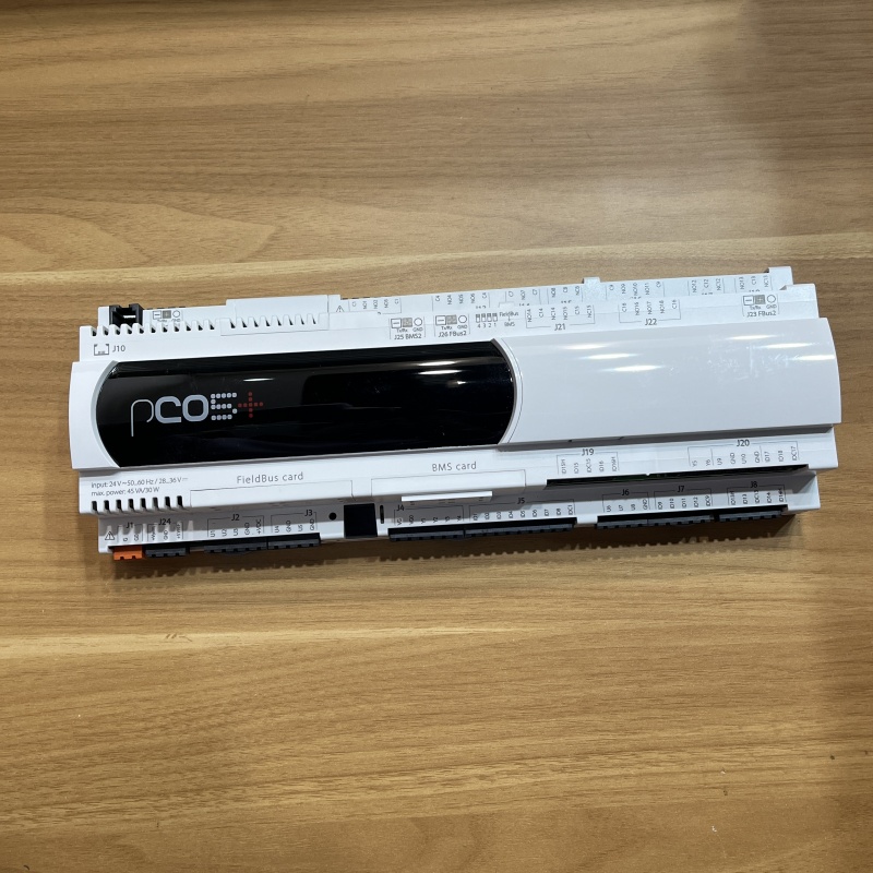 Front view of the industrial controller model P+500B0A000L0, featuring a display area, terminal blocks, and expansion card slots.