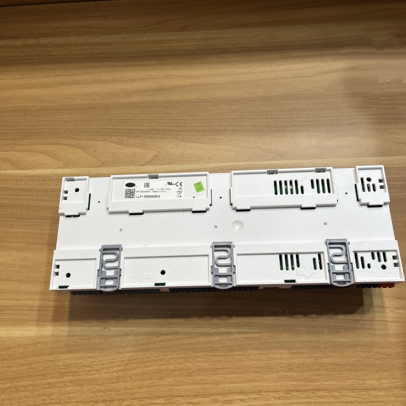 Rear view of the controller, showing DIN rail mounting clips and the product label.