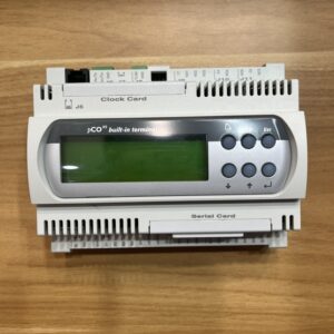Close-up of the front of an industrial programmable controller with a built-in LCD operator terminal
