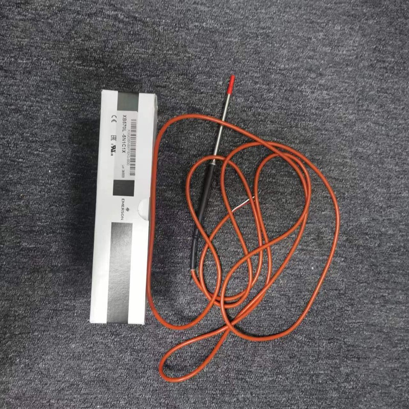 Matching temperature probe with orange high-temperature wire, next to package box