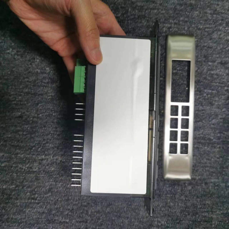 Rear cover of temperature controller, green terminals, metal pins and matching metal panel
