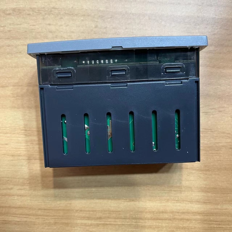 Another side view of the controller, showing ventilation grilles.