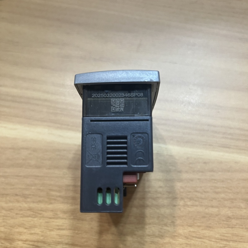 Side of temperature controller with QR code label and heat sink slots