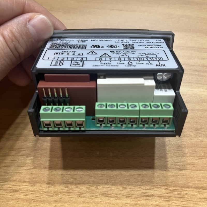 Close-up of green pluggable wiring terminals at controller bottom