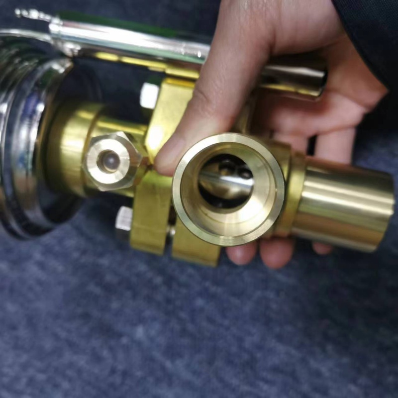 Inlet & equalizer port shot, hex adjusting nut displayed