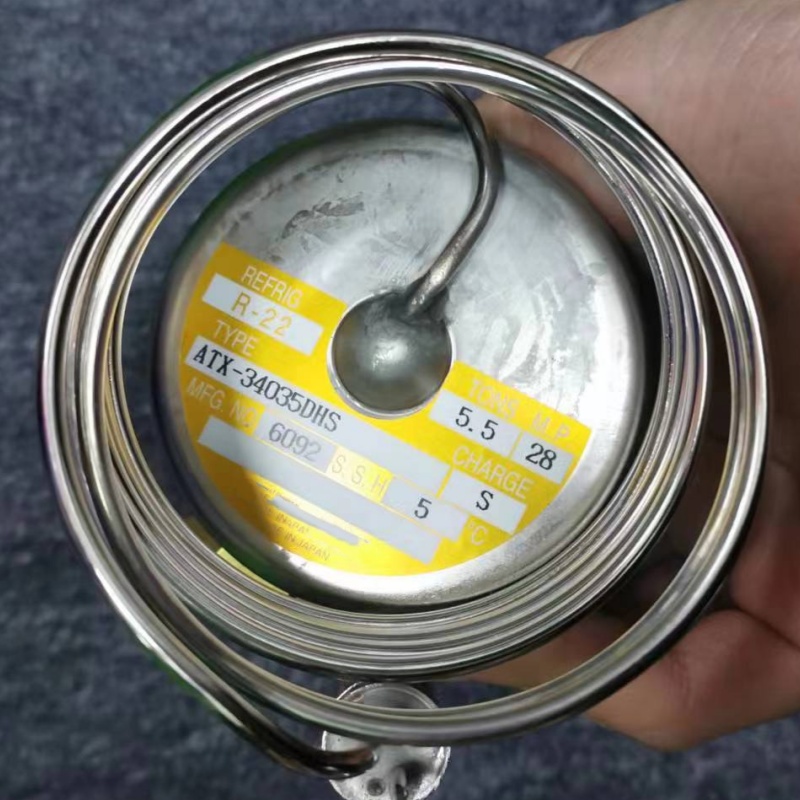 Close-up of nameplate on expansion valve power head