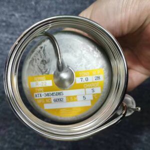 Close-up of expansion valve power head label with model, refrigerant and tonnage data